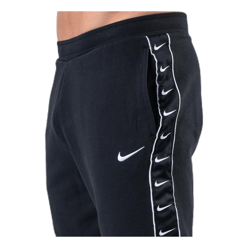 Nike swoosh taped track pants hot sale